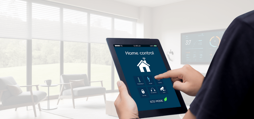 A person holding a tablet displaying a smart home control interface with options for managing various devices